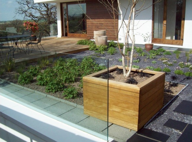 Wooden Planters and Glass Balustrade on Rooftop Garden