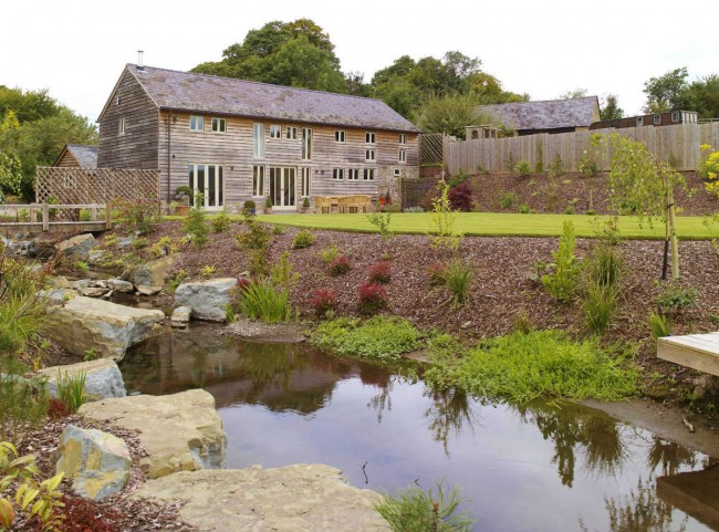 Border Oak house with natural water stream