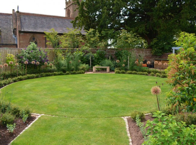 Circular lawn with stone bench